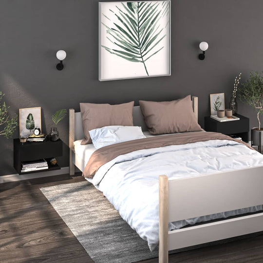 Modern bedroom with a white bed, black wall-mounted bedside cabinets, grey rug, and minimalist decor.