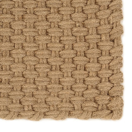 Rectangular jute rug with 2x2 rope knit pattern, showcasing natural texture and quality. Perfect for an affordable decor upgrade.