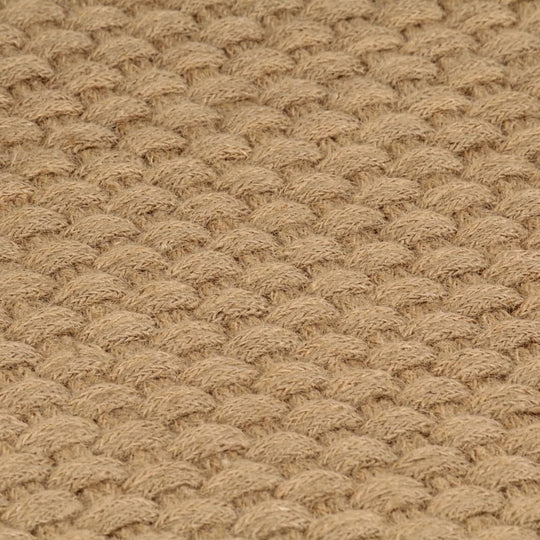 Close-up of 2x2 rope knit pattern on natural jute rug highlighting its soft texture and durable, affordable quality.