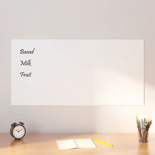 Wall-mounted magnetic board with text "Bread, Milk, Fruit" on a desk with clock, notebook, and pencils, showcasing affordable quality.