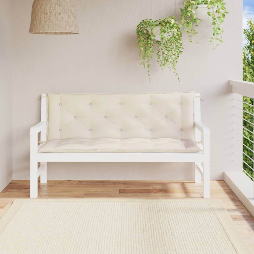 Cream white garden bench cushions on a white wooden bench, adding a fresh look to an outdoor living space.