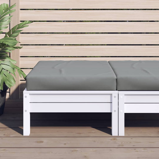 Grey pallet cushion on white bench in outdoor setting, featuring affordable quality Oxford fabric.