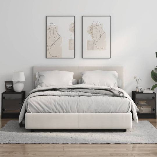 Elegant bedroom with white bed, affordable bedside cabinets with glass doors in black, wall art, and decor for a modern look