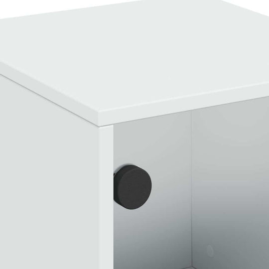 Close-up of white bedside cabinet with glass door featuring a black knob, showcasing quality and affordable design.