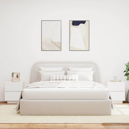 Modern bedroom with white bed, two bedside cabinets with LED lights, and minimalist decor for a stylish and affordable interior.