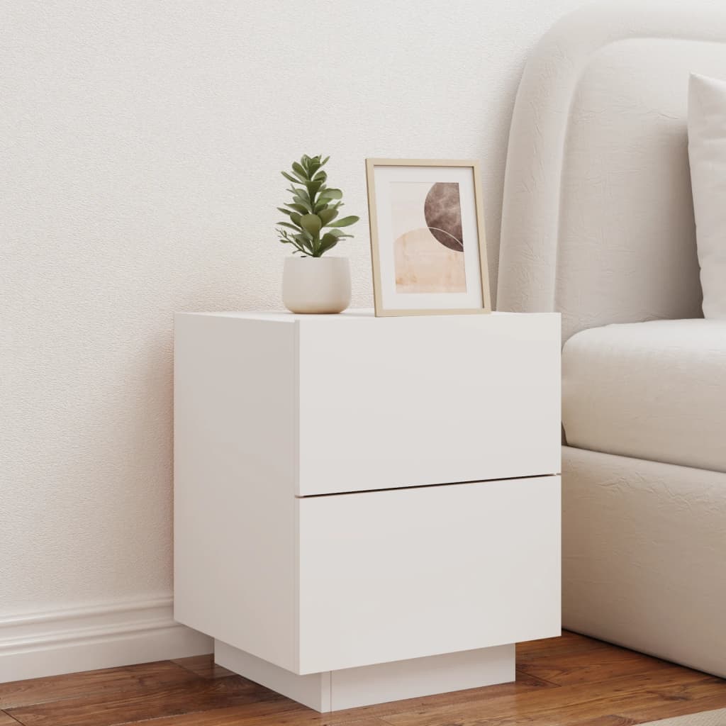 White bedside cabinet with RGB LED lights, engineered wood, displayed with decor items, affordable and quality home furniture.