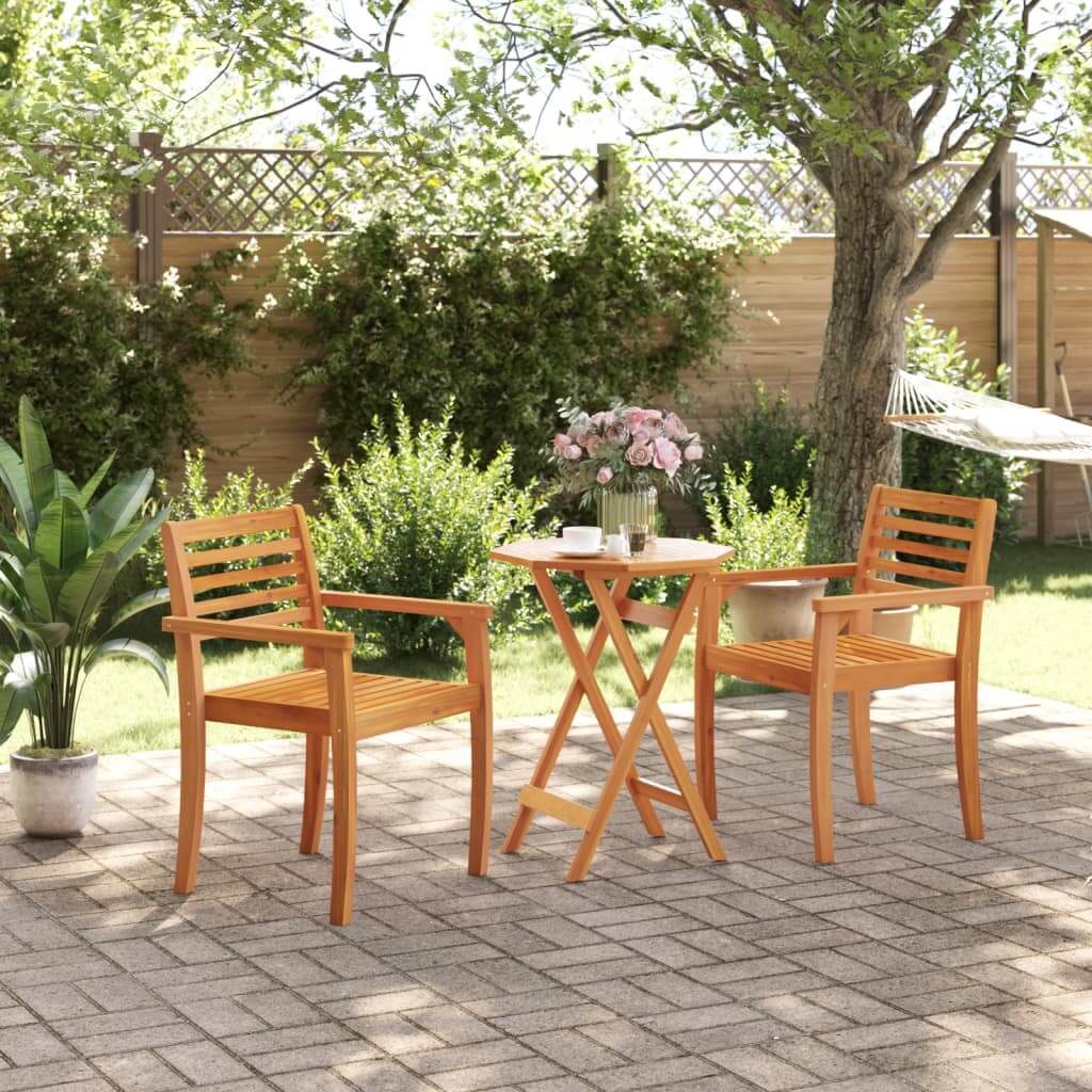 Folding garden table set with solid wood acacia chairs on patio, surrounded by plants and flowers, perfect for outdoor relaxation.