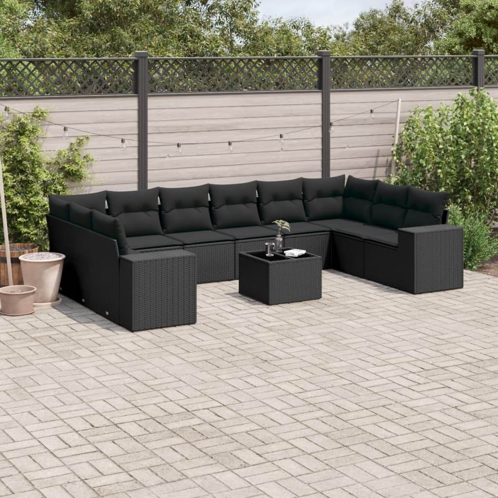 Black poly rattan garden sofa set on patio, featuring comfortable cushions, modern design, perfect for affordable luxe outdoor seating.