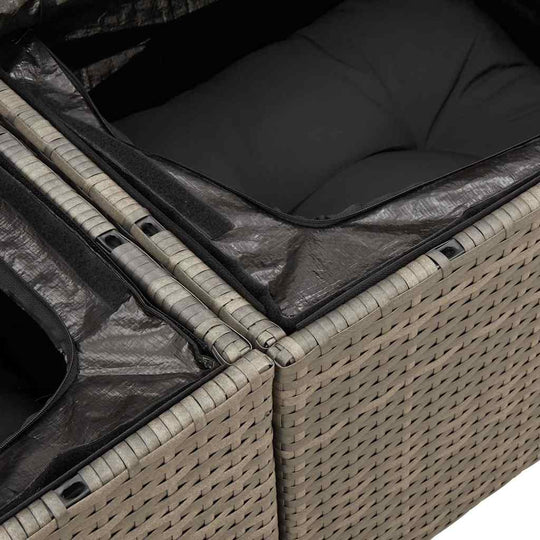 Close-up of the grey poly rattan garden sofa set showing storage compartments and black cushions, highlighting quality and affordable luxury.