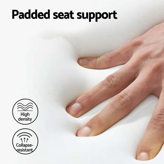 Hand pressing on a padded seat showing high density and collapse-resistant support for comfort.