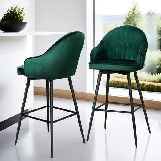 Elegant green velvet bar stools with metal legs, perfect for luxurious DIY home decor.