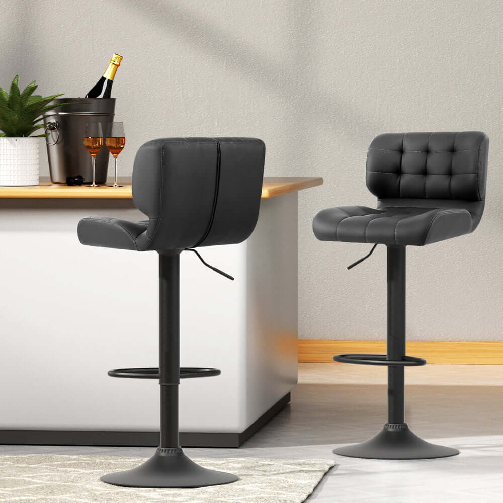 Stylish grey leather bar stools with gas lift; affordable and quality furniture for modern decor.