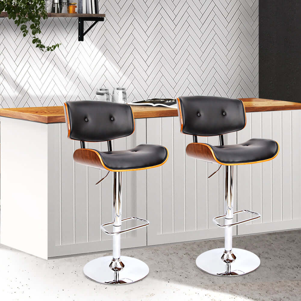 Elegant Artiss bar stools with gas lift in black leather and wooden accents, ideal for modern spaces and DIY projects.