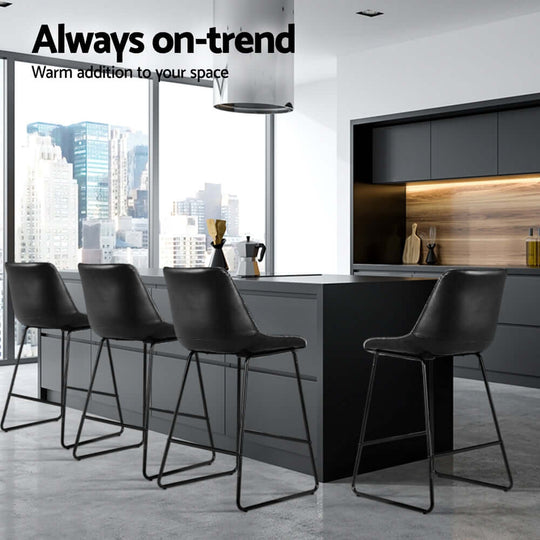 Modern black leather bar stools with metal legs, perfect for enhancing contemporary kitchen aesthetics.