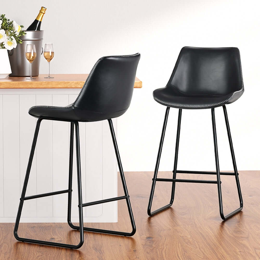 Artiss 4x black leather padded bar stools with metal legs, ideal for affordable luxury and stylish decor.