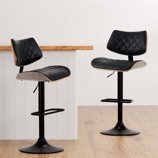 Artiss black bar stools with quilted PU leather and wood accents, adjustable height for stylish kitchen dining.