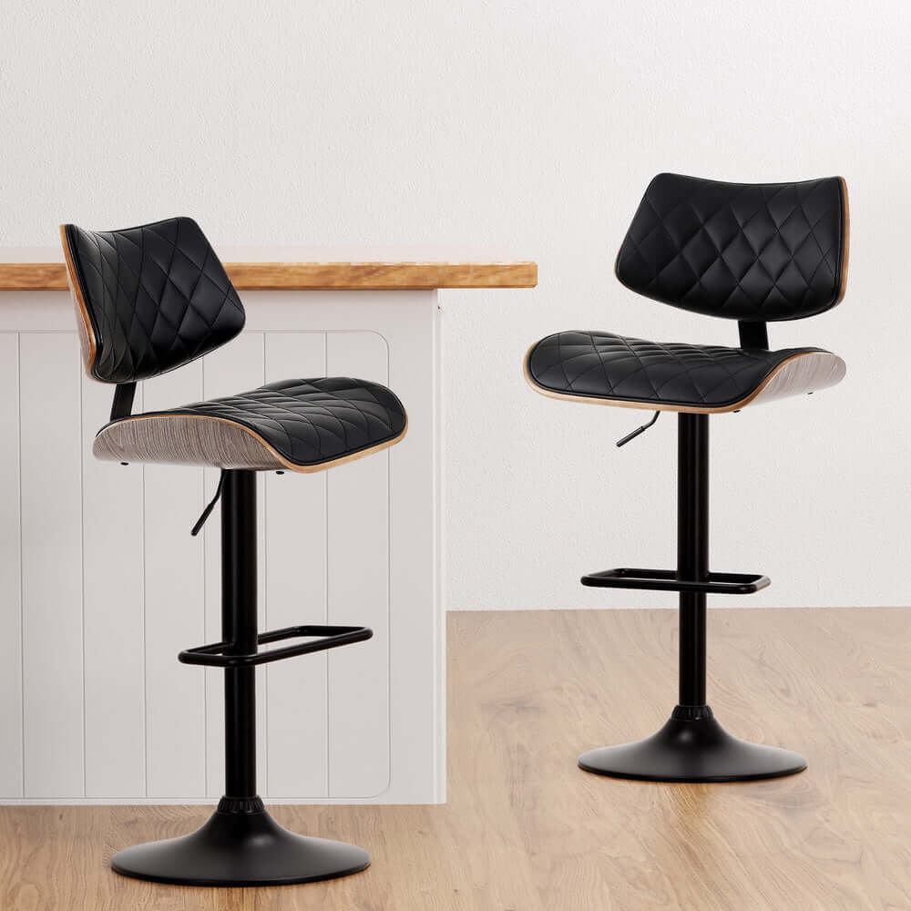 Artiss black bar stools with curved wood and padded leather, perfect for affordable luxury in your kitchen or dining room.