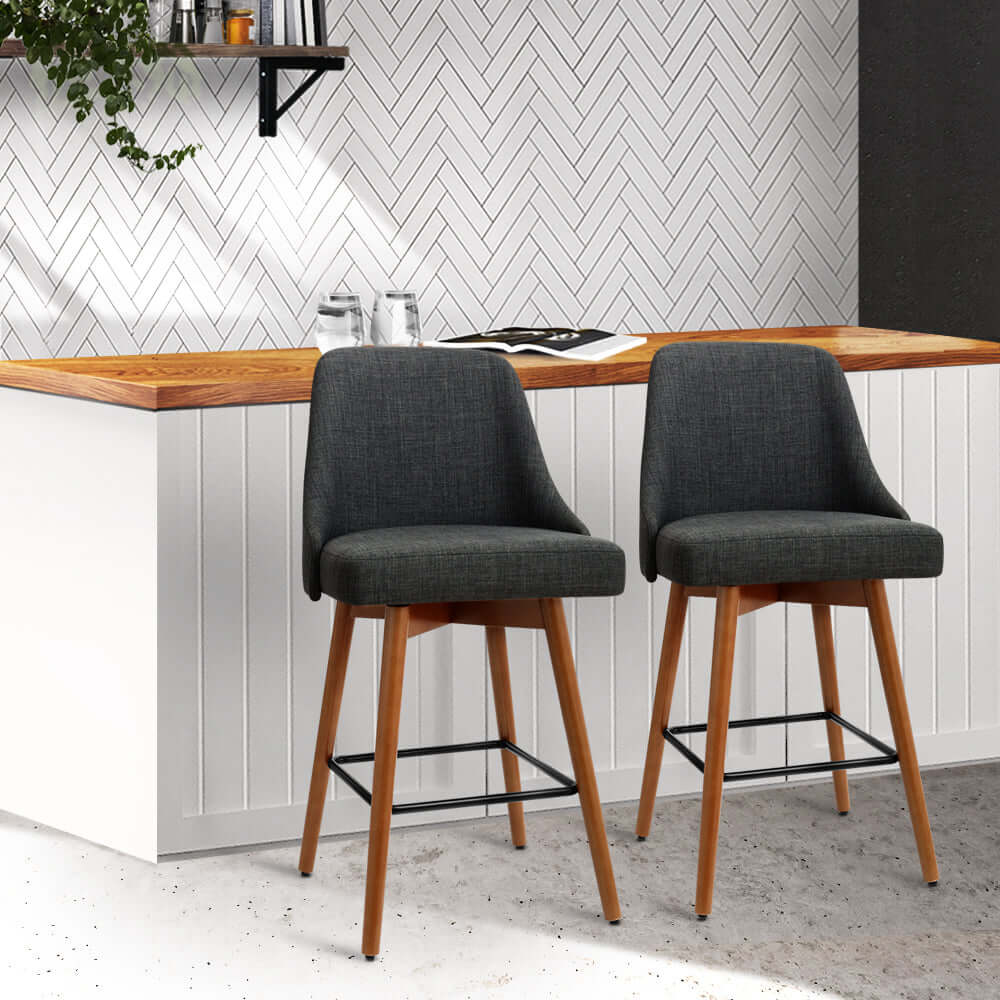 Affordable Artiss 2x swivel bar stools with charcoal faux linen and wooden legs, ideal for DIY home decor.