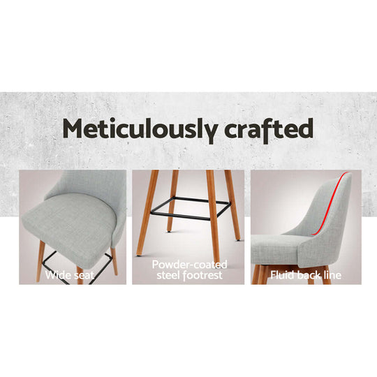 Meticulously crafted bar stool features wide seat, powder-coated steel footrest, and fluid back line for comfort and style.