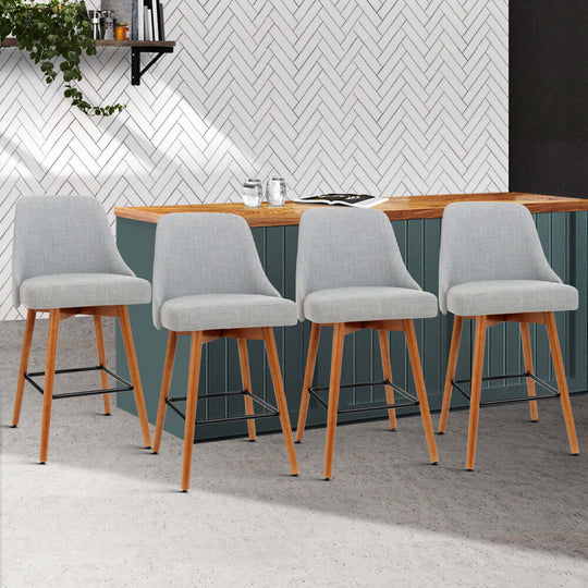 Affordable Artiss 4x grey bar stools with swivel seats and wooden legs in a modern kitchen setting.