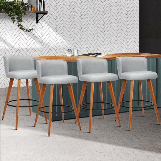 Artiss 4x affordable grey linen padded bar stools with wooden legs in modern kitchen setting.