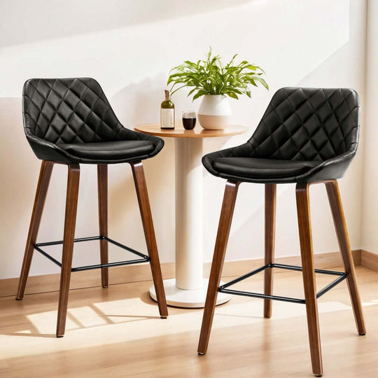 Affordable luxe bar stools with PU leather seats and wooden legs, ideal for DIY decor.