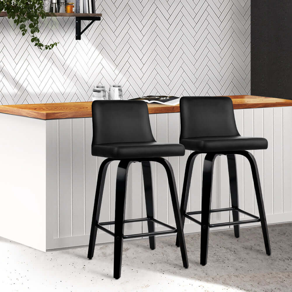 Affordable Artiss leather bar stools with padded backrest, 360-degree swivel, and stylish black finish for modern kitchens.