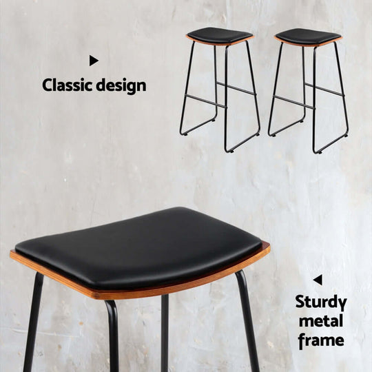 Artiss 4x bar stools with classic design, sturdy metal frame, and faux leather padded seat for affordable luxury.