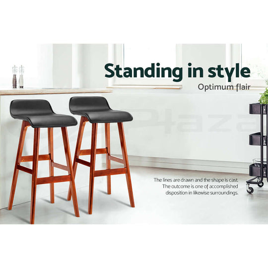 Affordable black wooden bar stools with PU leather seats, blending quality and luxury for a stylish home.