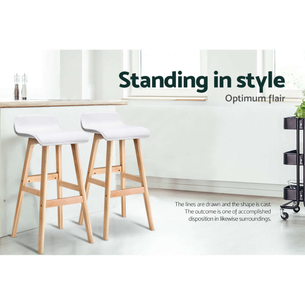 Affordable Artiss 4x White Wooden Bar Stools featuring stylish PU leather seats and elegant design in modern surroundings.