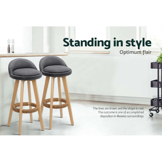 Stylish grey bar stools with padded linen seats and wooden legs, perfect for affordable and quality home decor.