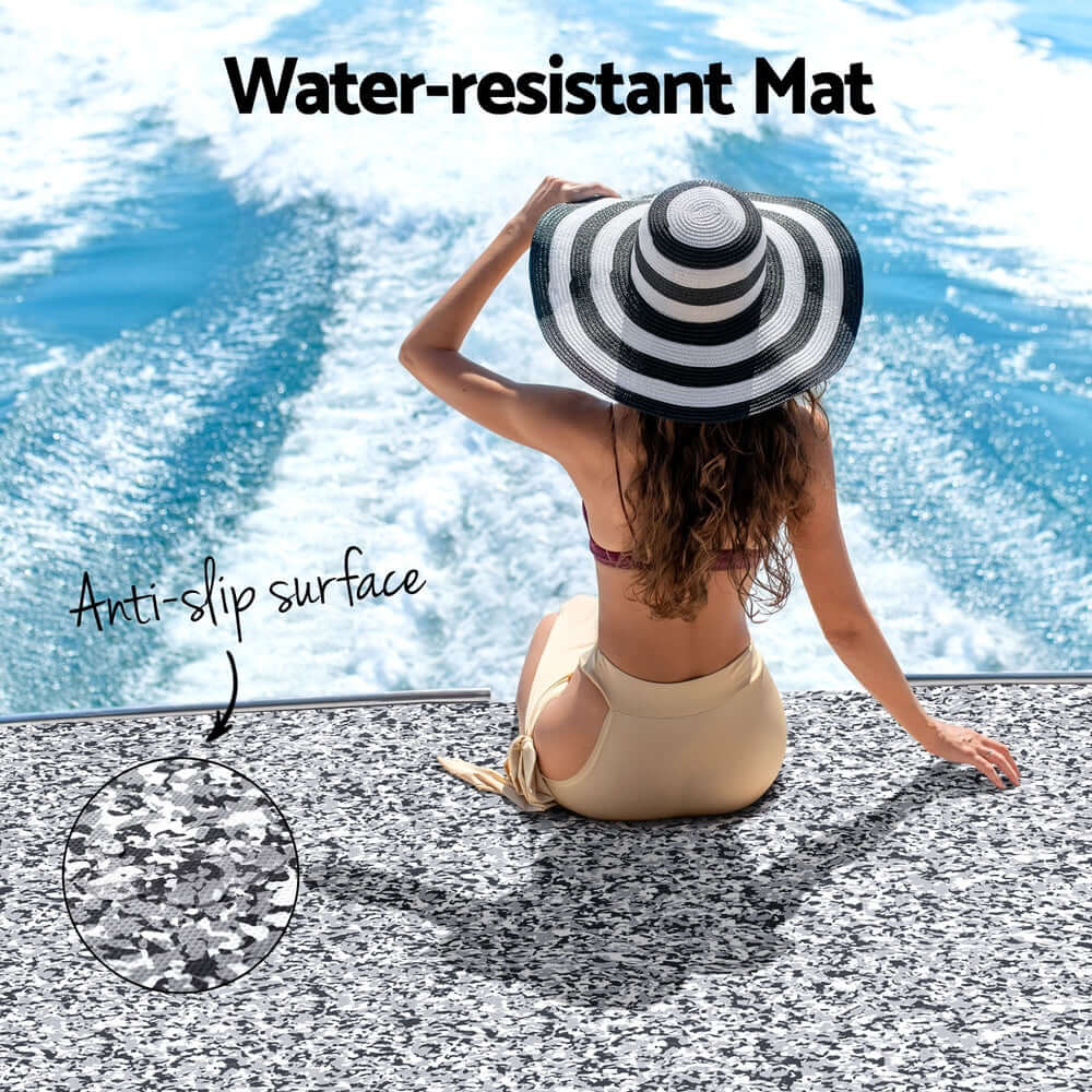 Woman in a hat sitting on a water-resistant anti-slip EVA boat mat, showcasing stylish and durable flooring.