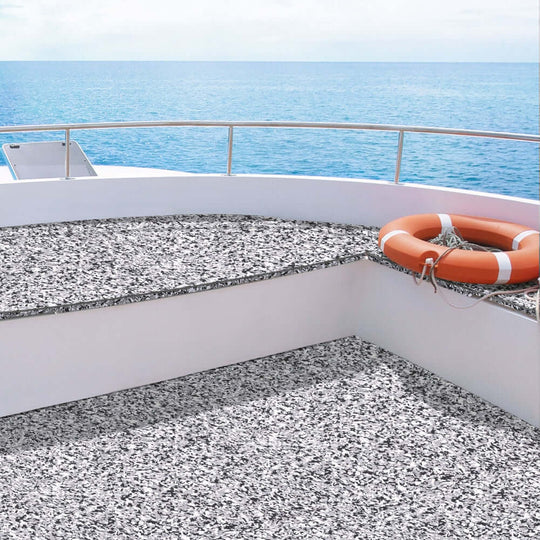 Seamanship EVA foam boat flooring in camo design on a boat deck, featuring a lifebuoy and ocean view.