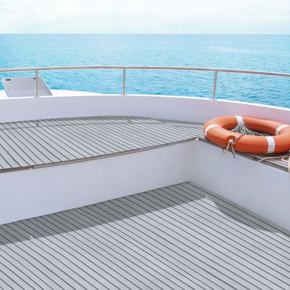 Light grey EVA foam boat flooring mat on a yacht deck, featuring a life buoy and ocean view for a luxury DIY upgrade.