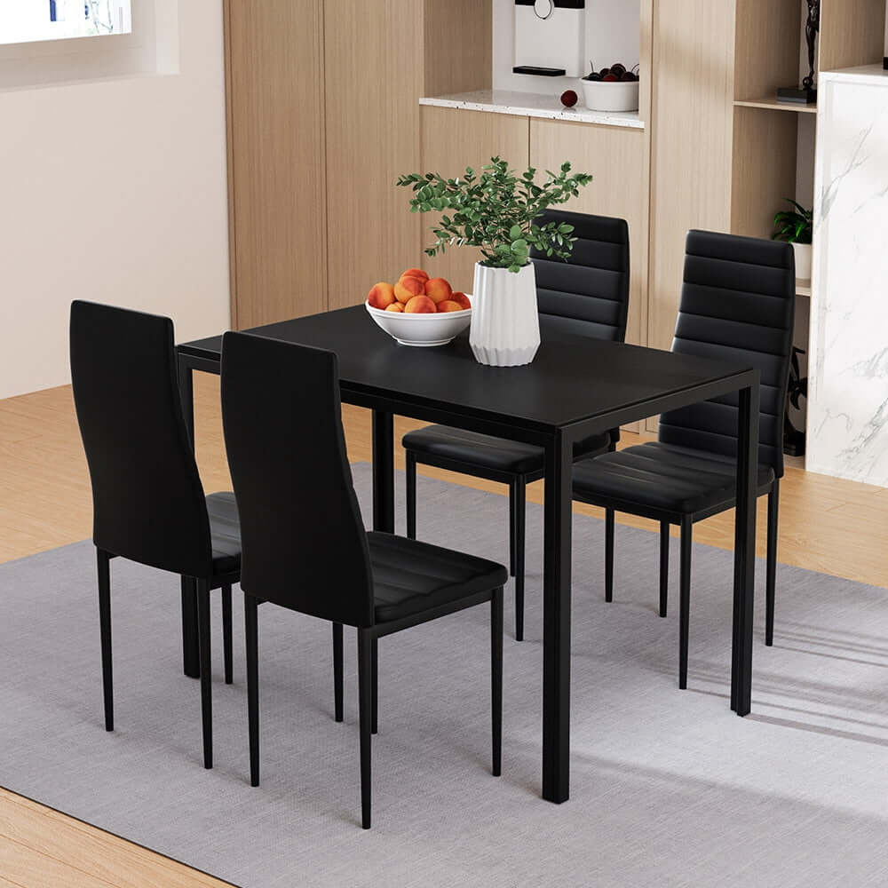 Modern Artiss dining set with 4 black chairs and dining table in stylish minimalist dining room.