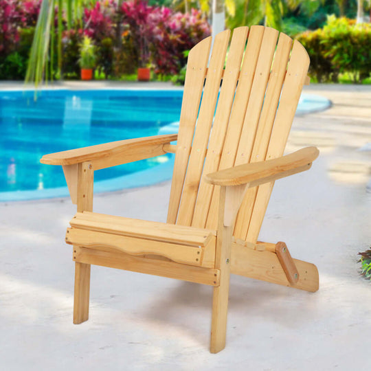 Natural wooden Adirondack chair by poolside, perfect for outdoor relaxation and summer vibes.