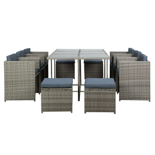 Gardeon 11-piece wicker outdoor dining set with grey cushions, including six chairs, four ottomans, and a spacious table.