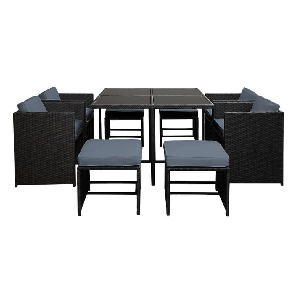 Affordable 9-piece Gardeon outdoor dining set with black wicker, grey cushions, and tempered glass table.