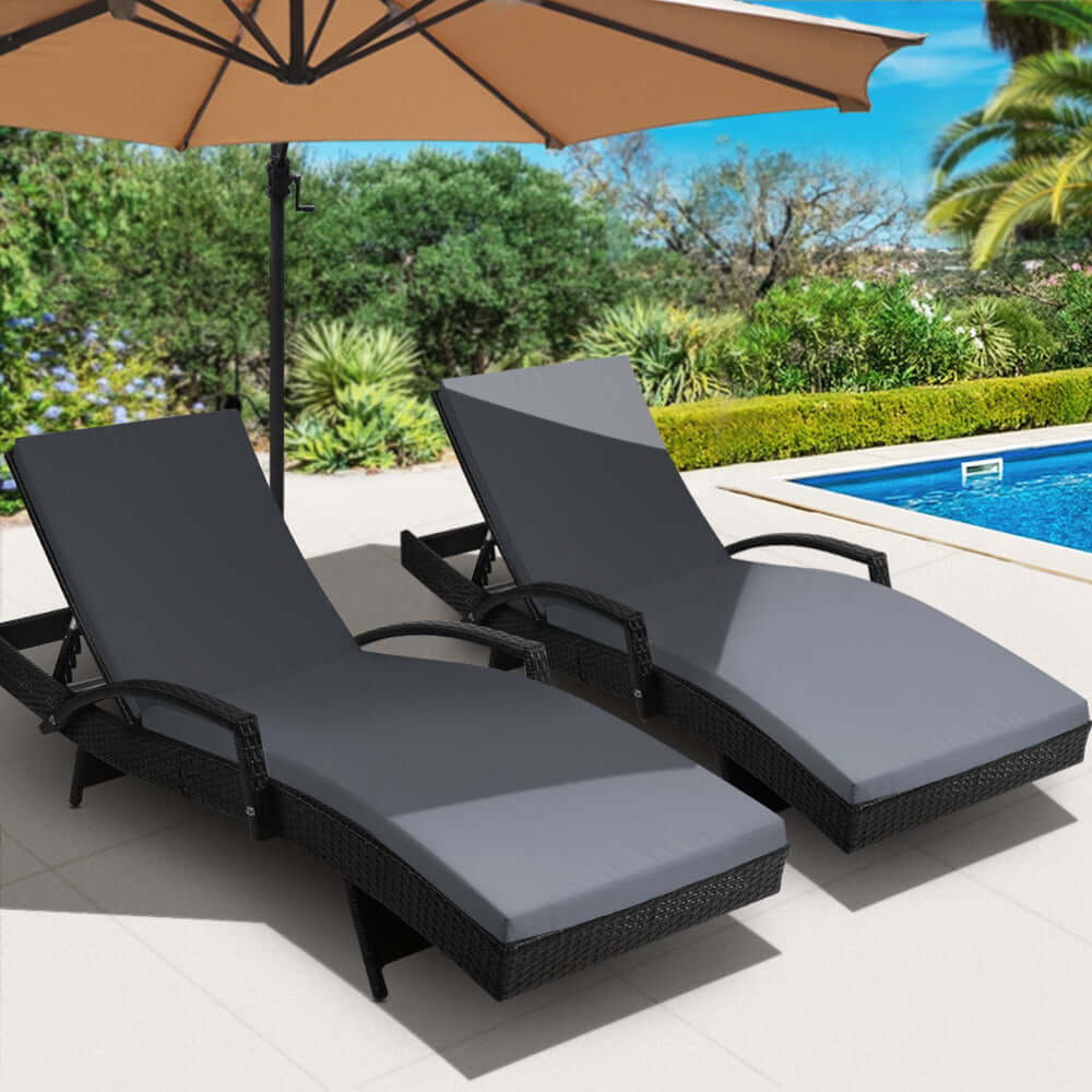 Gardeon 2PC Black Wicker Sun Lounge with Adjustable Cushions by poolside, perfect for affordable outdoor relaxation.