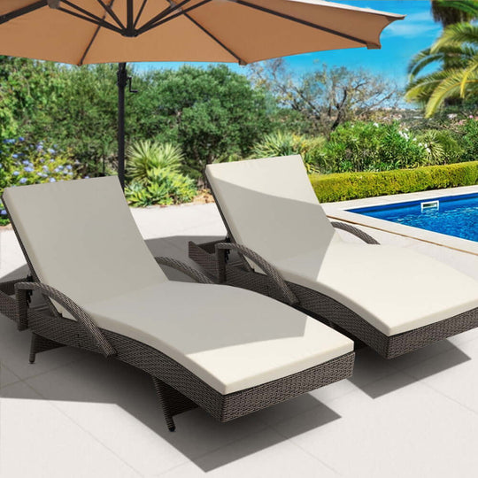 Gardeon 2PC Grey and Beige wicker sun loungers with adjustable cushions by poolside, perfect for affordable outdoor relaxation.