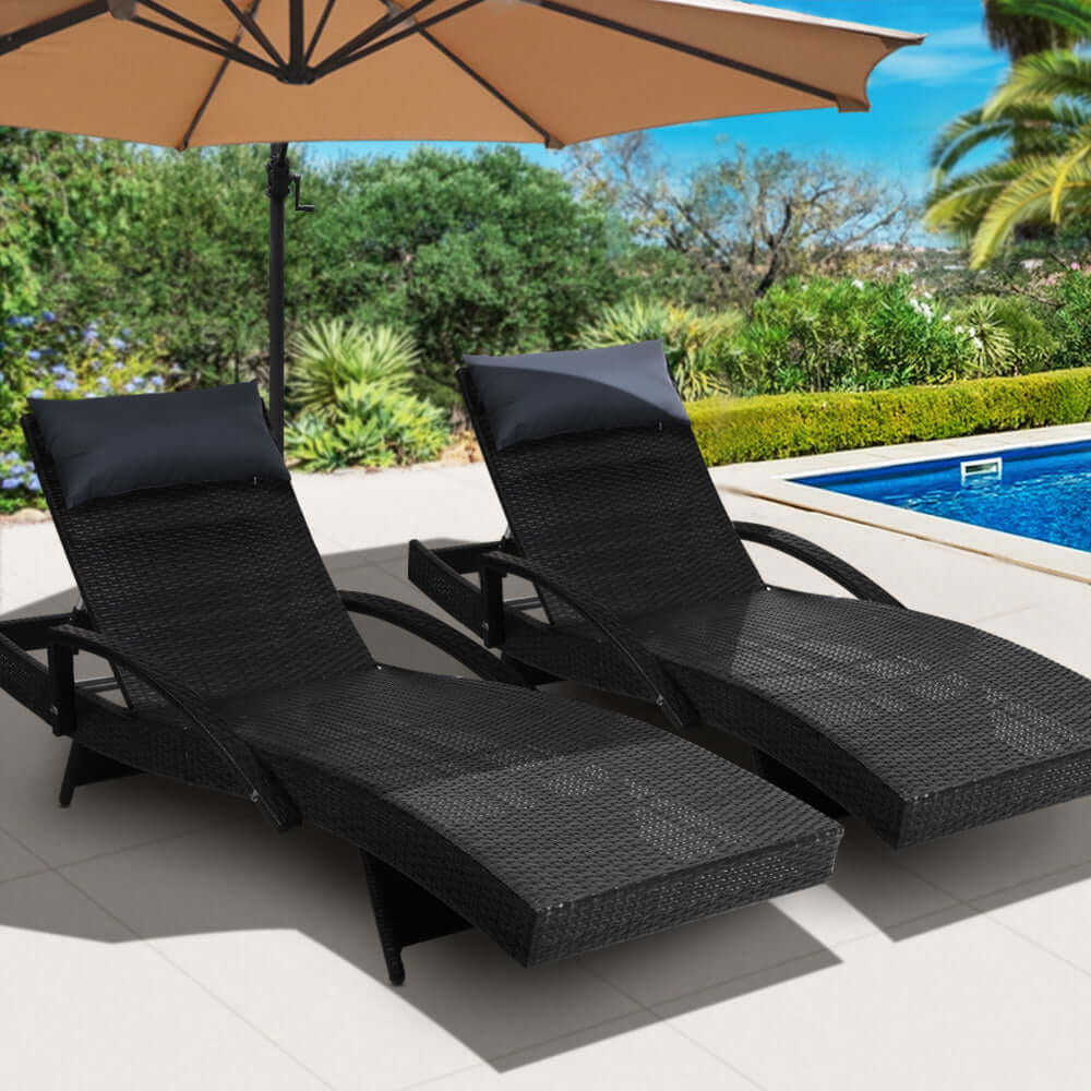 Gardeon 2x adjustable black wicker sun loungers by the pool, perfect for affordable outdoor relaxation and sunbathing.