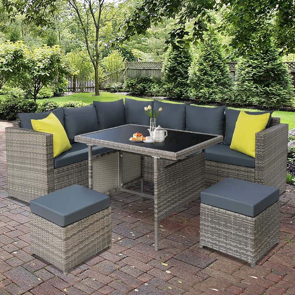 Gardeon affordable outdoor dining set with grey wicker chairs and table in garden setting, perfect for luxurious relaxation.