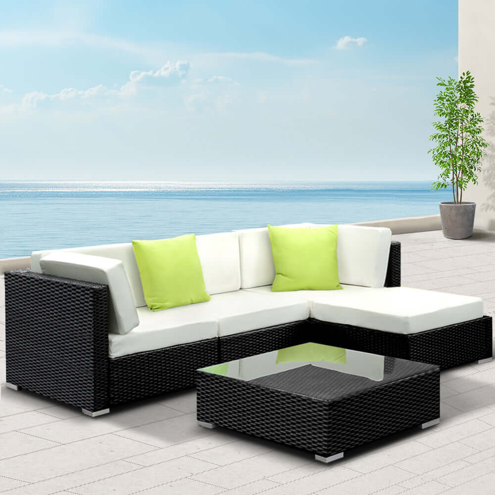 Gardeon 5-piece outdoor sofa set with black wicker and green cushions, perfect for affordable luxury and comfort.