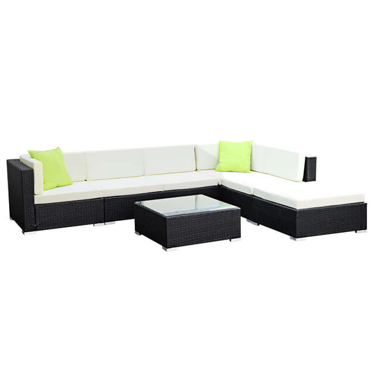 Gardeon 7-piece outdoor sofa set in black wicker with cream cushions and green accents, ideal for affordable luxury lounging.