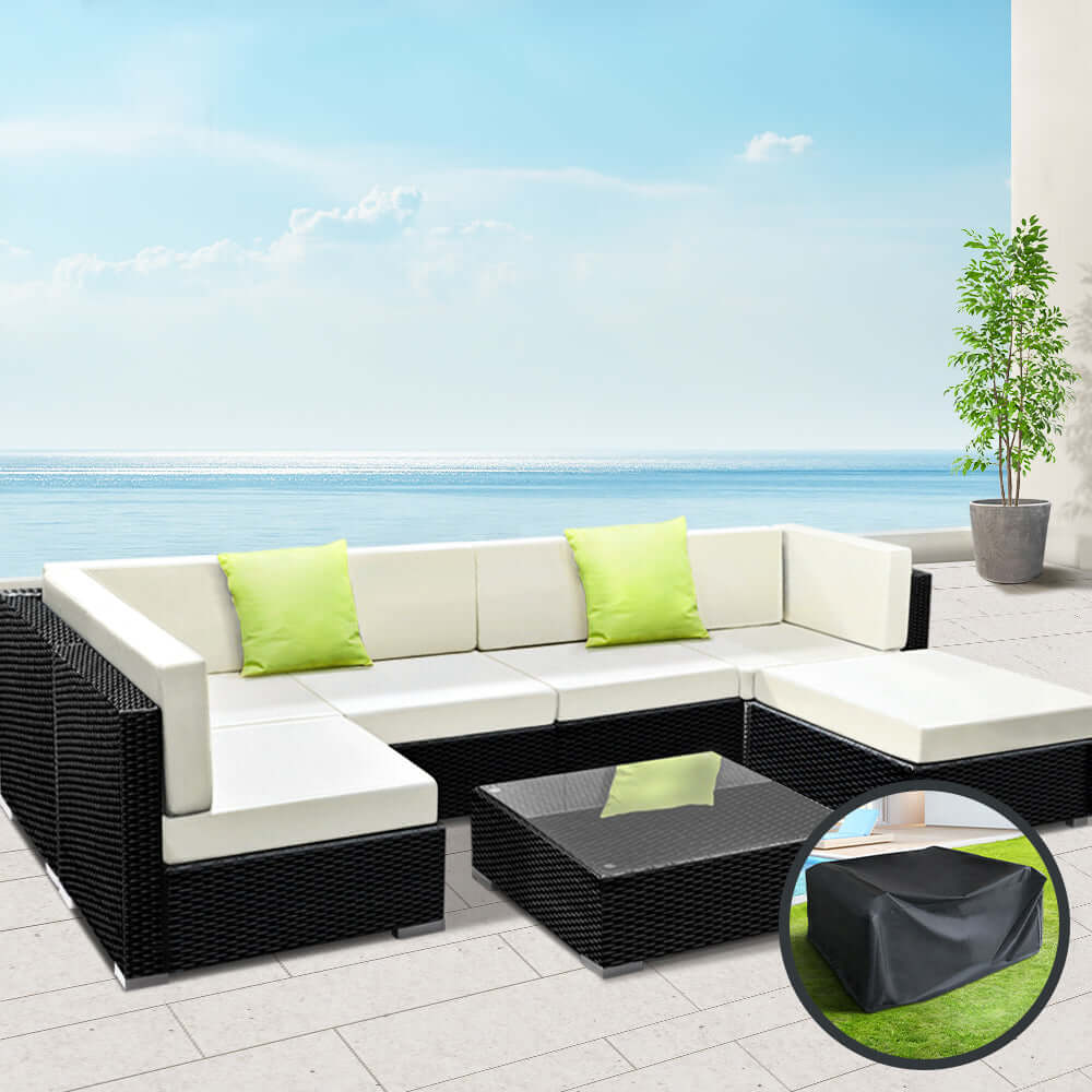 Gardeon 7-piece outdoor sofa set with green cushions, black wicker couch, and glass table cover for stylish patio comfort.