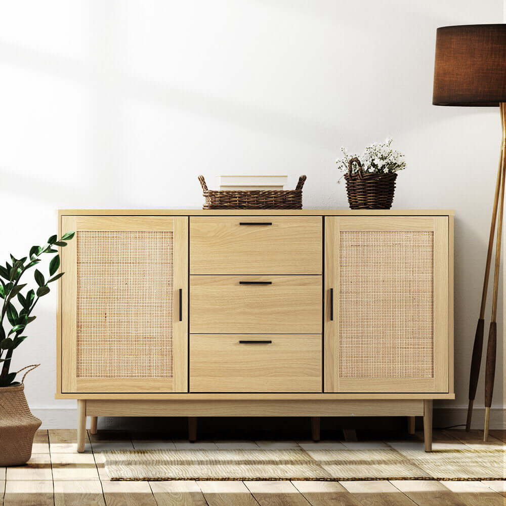 Artiss Rattan Buffet Sideboard BRIONY Oak in a bohemian styled room with lamp and plants