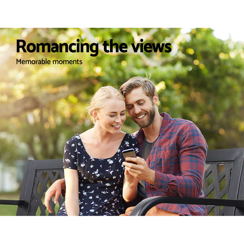 Couple enjoying a moment together on a garden bench, highlighting memorable outdoor experiences.