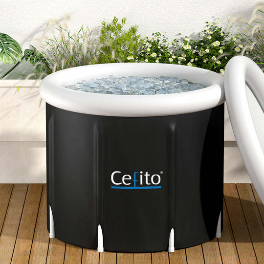 Portable ice bath tub filled with ice, perfect for post-workout recovery and relaxation, set on a wooden deck with greenery.