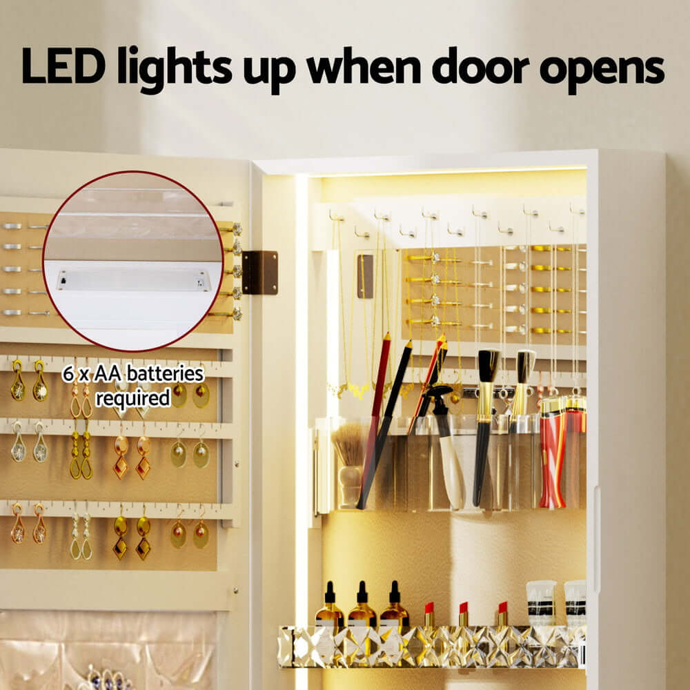 LED-lit jewellery cabinet interior with storage for earrings and makeup tools, designed for easy access and organization.