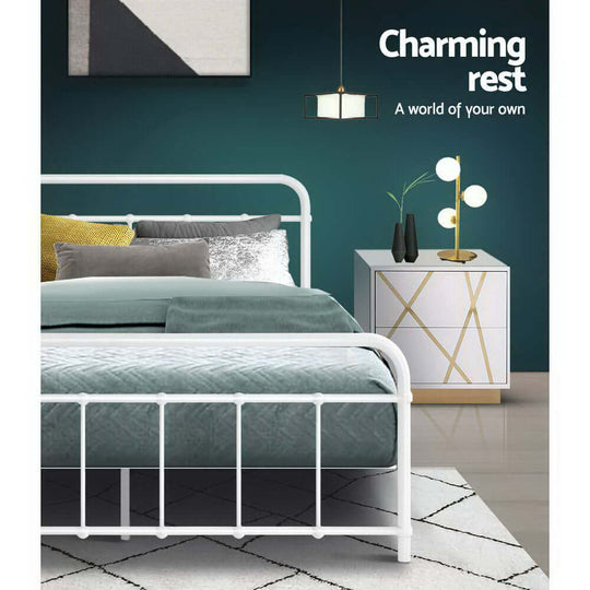 Elegant white metal bed frame in a cozy bedroom setting with stylish decor and soft bedding.